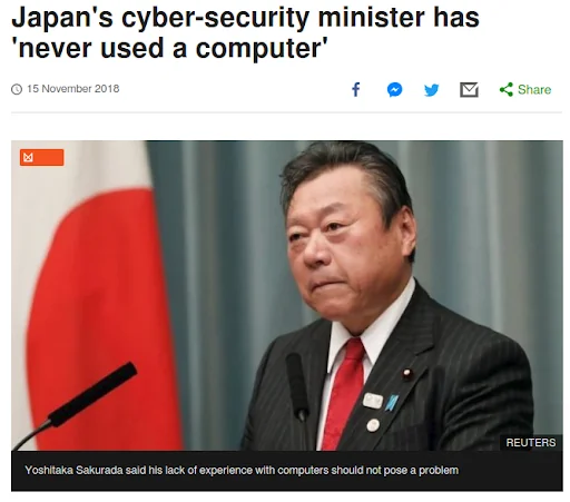 BBC News screenshot: ‘Japan’s cyber-security minister has never used a computer’, with a Reuters photo of Yoshitaka Sakurada at a press podium